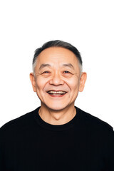 Obraz premium Smiling elderly Asian man wearing black shirt isolated on white background expressing happiness and joy, portrait of mature male with friendly demeanor.