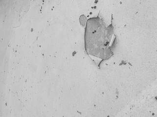 The Walls and backgrounds Old cement walls with black stains on the surface caused by moisture. Peeling wall surface with cracks and scratches, old rough gray cement wall surface for the background.