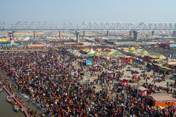 Prayagraj,India-28 pJanuary 2025 Top angle view of the crowd bathing at Sangam on the banks of...
