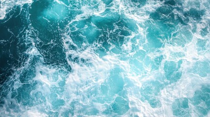 Fototapeta premium Aerial view showcases churning waves in the clear turquoise ocean