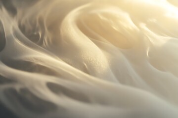 Abstract smoke background with smooth, flowing lines and a soft, golden light, creating a delicate, dreamy atmosphere.