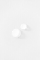 Pure water drops minimal white background. Cosmetic product sample. Moisturizer skincare serum isolated on white
