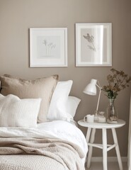 Neutral bedroom with framed art and bedside table