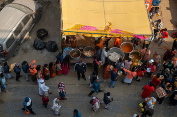 Prayagraj,India-28 pJanuary 2025 Some people are serving free food to the devotees at the Kumbh...