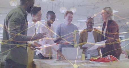 Diverse team collaborating in office with network connections animation overlay - Powered by Adobe