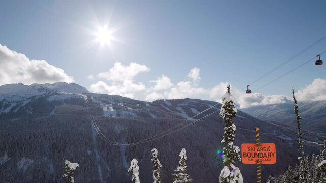 Whistler Mountain Peak2Peak gondola, ski mountain, sunny day, winter, ski hill. 4k 24fps