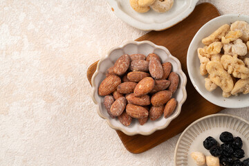 Flavored mixed nuts in bowls.