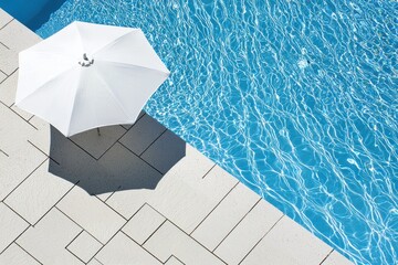 Umbrella shadow on a pool deck, with water ripples and tiles, cooling in a summer shaded light moment