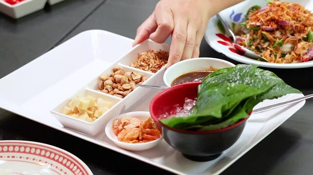Preparing Miang Kham Savoury Leaf Wraps