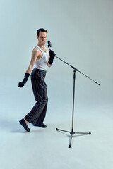 Rhythmic tension embodied in angular stance, artist fully immersed in musical expression,...