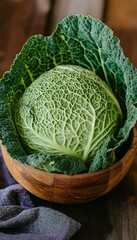 Freshly Harvested Savoy Cabbage in Rustic Wooden Bowl, Close Up, Organic Produce from the Garden