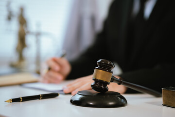 Professional lawyers consult with clients in the office on legal agreements, contracts and financial matters to ensure fairness and compliance with the law.