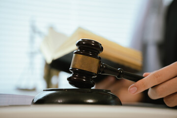 Professional lawyers consult with clients in the office on legal agreements, contracts and financial matters to ensure fairness and compliance with the law.