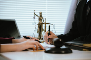 Professional lawyers consult with clients in the office on legal agreements, contracts and financial matters to ensure fairness and compliance with the law.