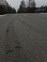 Car wheel tracks on the asphalt