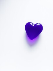 Fototapeta premium Beautiful purple heart shape symbolizing love and affection set against a soft and dreamy background