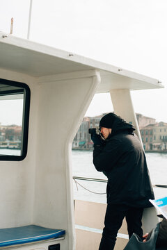 man taking pictures on a ship