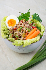Ready meal healthy food, bean mix, lentils, peas and vegetables, greens in a bowl. Close