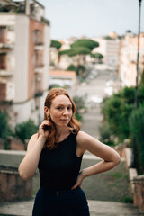 Fototapeta premium Portrait of a red-haired girl in Rome