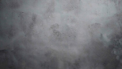 Fototapeta premium The image shows a dark grunge concrete wall with a textured surface, an aged concrete floor, and a vintage industrial feel