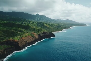 Hawaiian Coastline: An aerial view of the rugged beauty of the Hawaiian coastline, with lush green mountains meeting the turquoise blue waters of the Pacific Ocean.