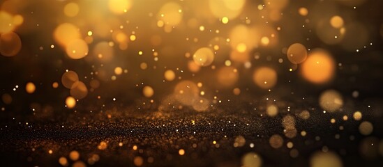 Fototapeta premium Golden blurred background with bokeh effect featuring circular light spots in varying sizes and shades of yellow and gold on dark base.
