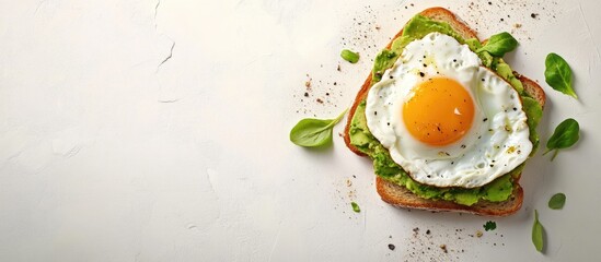 Avocado toast topped with a poached egg on golden bread, positioned centrally against a soft light background with space for text on top.