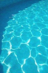 Obraz premium Invitingly clear, vibrant blue pool water close-up, crystal, refreshing