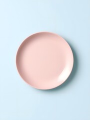  Delicate pink plate resting on a soft pastel blue background with a minimalistic design