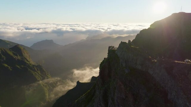 Epic sunrise at Ninho da Manta viewpoint, majestic mountains of Pico do Areeiro, Madeira Aerial Drone