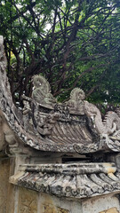 Naklejka premium Sandstone doll at Wat Pho that is a Buddhist temple complex Chinese and Thai style in Bangkok, Thailand