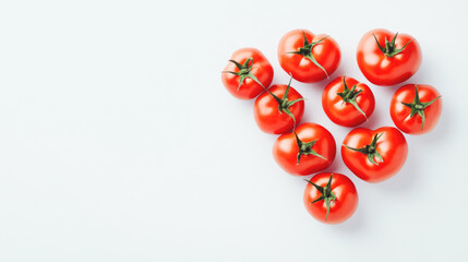 Fresh red tomatoes arranged on white background