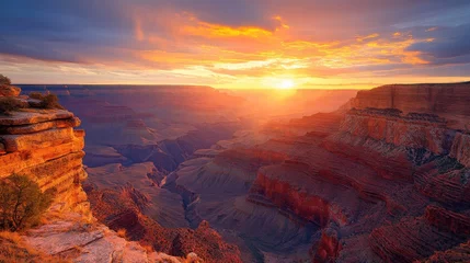 Canyon landscape at sunset. Colorful sky above the rocky valley. Desert scene with dramatic light. Nature background with canyons and sun.