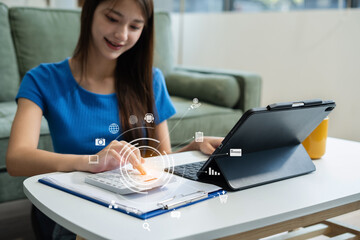 Lifestyle of office workers, young woman calculating expenses and using laptop at home office.