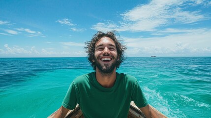 Fototapeta premium Joyful man standing at the bow of a boat enjoying the ocean view