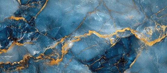 Fototapeta premium Rich blue and gold marble texture background featuring swirls of deep ocean blue and vibrant gold veins creating an elegant luxury ambiance