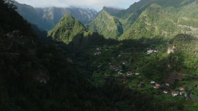 Aerial view of stunning valley and mountains with green lush vegetation on Madeira island, Portugal