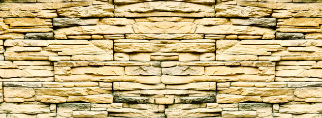 Sandstone bricks, wide wall made of weathered sandstones, stone wall background