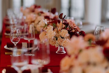 Elegant Dining Table with Flowers and Glassware for Special Occasion