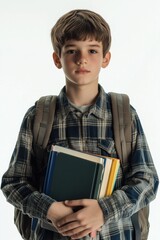 Obraz premium Student with backpack and books, posing for education-themed photo.