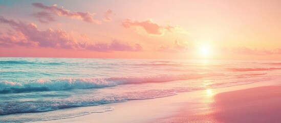 Obraz premium Sunset over a serene beach with gentle pastel colors pink and orange in the sky reflecting on calm ocean waves against a soft sandy shore