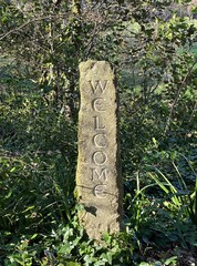 carved stone column, welcome waystone