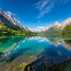 Fototapeta premium serene lake with crystal-clear water reflecting a bright blue sky,