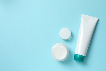 Natural cosmetic products a blue background, top view