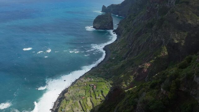 Epic aerial drone shot of steep cliffs coastline on Madeira, Portugal