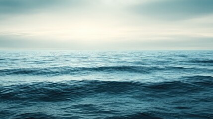 Obraz premium A peaceful ocean view with calm waves, symbolizing tranquility and success after overcoming challenges, with ample sky space for text.