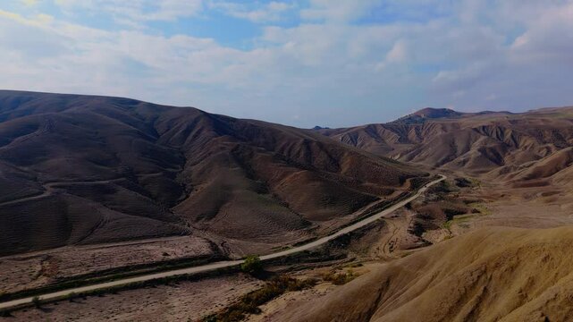 Aerial pull-out view of Calanchi del Cannizzola (or Deserto dei Calanchi), known as the &ldquo;Sicilian desert&rdquo;, a series of clay formations in the East part of Sicily