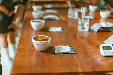 Barista preparing to test and inspecting the quality of coffee