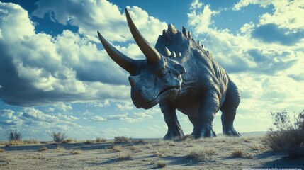Fototapeta premium A statue of a triceratops, an extinct dinosaur, standing in the middle of a barren landscape with sandy terrain and sparse vegetation.