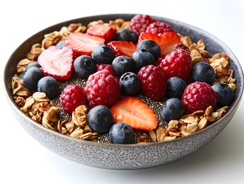 Colorful bowl of fresh fruits and granola with chia seeds for a nutritious breakfast treat full of flavor